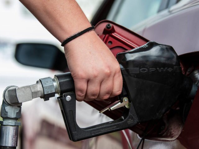 Customer Fueling Passenger Vehicle At Gas Station In Utah